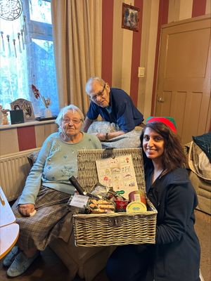 Mr & Mrs Glover with clinical manager, Kim Pooni and the winning hamper