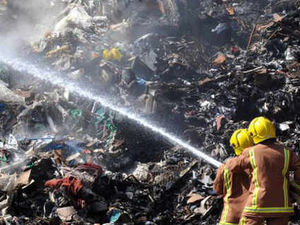 Supporting image for story: Rubbish blaze smoulders on - 10 days on
