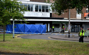 A blue forensic tent on the corner of Aldridge High Street on Saturday morning