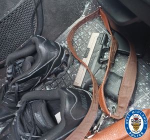 Searches of the car revealed a live handgun and more than 50 rounds of ammunition, as well as a number of swords inside the vehicle