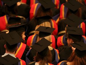 Students in graduation gowns