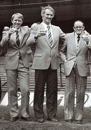 Graham Hawkins, Derek Dougan and John Ireland toast promotion in 1983