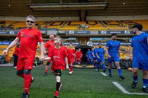 Tecman players & Mascot Alfred walking onto the pitch. Credit: Ed Bagnall