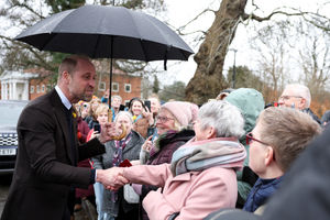 The Prince of Wales greets members of the public as he arrives to visit the Oriel Davies art gallery in Newtown