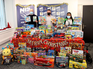 Supporting image for story: Wolverhampton firm NIS collect piles of Christmas presents for needy children