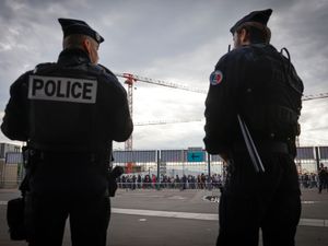 Police officers stand guard near the Stade de France