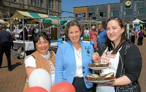 Diana Flint giving a helping hand to volunteers at a market in Oswestry