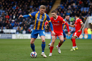 Taylor Moore of Shrewsbury Town and Lewis Wing of Wycombe Wanderers (AMA)