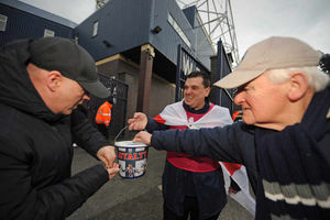 Stuart Morris collects money outside the Hawthorns