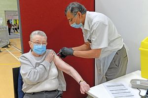 Dr Nanda Pilla gives Beatrice Betts her shot.