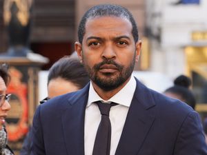 Head and shoulders photo of Noel Clarke in suit, shirt and tie