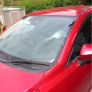 The windscreen to the Mazda was smashed.
