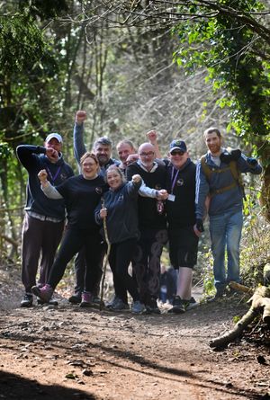 Walking up the Wrekin to raise money for Tact were (front) Talia Forrester and Gemma Aston , and (back) Alex Graham, Carl Foulkes, Carl Powell, Steve Stuart, Jaws and Gary Biggs