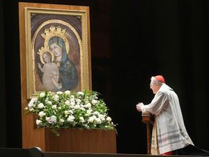 Cardinal Arthur Roche prays during a rosary prayer for Pope Francis’ health in St Peter’s Square at the Vatican