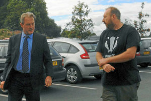 A protester confronts the MP in Oswestry