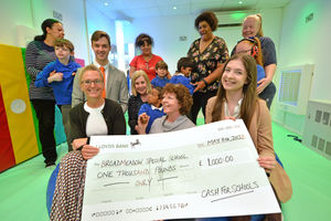 Broadmeadow Special School in Wolverhampton came in fifth place and won £1,000. Pictured: assistant headteacher Dawn Beamer with students and sponsors.