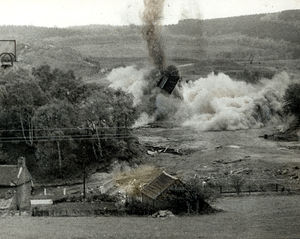 A 130ft chimney comes crashing down at Brereton Colliery. Men from 213 Field Squadron from Cannock and Stafford did most of the work before the demolition, which took place in 1962. The men also disposed of most of the surface installations of the disused colliery.
