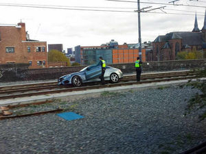 Supporting image for story: Midland Metro services hit as car gets stuck on tram line