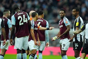 *Re-transmitting correcting colour of card to red* Aston Villa's Jhon Duran (second from right) is shown a yellow card by referee Anthony Taylor (obscured) during the Premier League match at St. James' Park, Newcastle upon Tyne. Picture date: Thursday December 26, 2024.