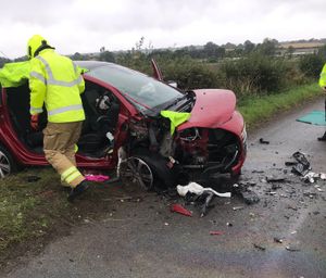 Firefighters making one of the vehicles safe. Photo: Wolverhampton Fire