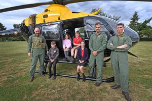 Helicopter landing at St George's Junior school, Shrewsbury. Pictured year six pupils with pilots (from left) Mark Rose, Simon Harrison and Tom Brown. Photo: Tim Sturgess