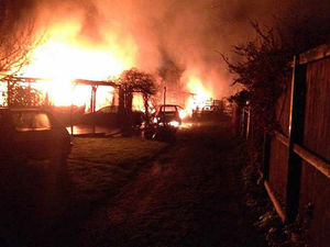 Supporting image for story: Neighbours' shock as fire destroys garages