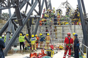 Emergency services work to free those trapped on the Smiler ride in June last year