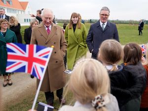 The King accompanied by Prime Minister Sir Keir Starmer and Deputy Prime Minister Angela Rayner during a visit to Nansledan School in Newquay