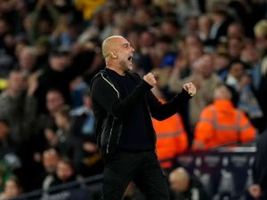 Pep Guardiola celebrates Manchester City's winning goal against Aston Villa