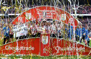 Lincoln lift the trophy