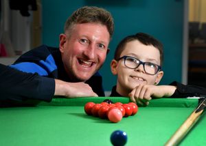Tommy with PE teacher Ryan Lamb, who has supported him by purchasing a snooker table for the school.