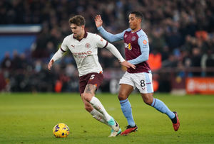 Manchester City's John Stones and Aston Villa's Youri Tielemans 