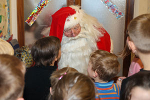 Ray Hulse, 78, from Bridgnorth, Shropshire, who is Britain's longest serving santa who has been doing it for 60 years. Ray Hulse meeting children at St Leonard's Hall, Bridgnorth. 03/12/2022.