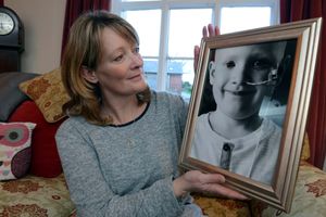 Sally Johnson with a picture of her son Harry, who died aged seven in 2014