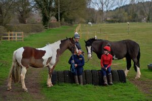 Denise O'Reilly, owner of TDS Riding Centre, with horses George and Dave, and Danielle Thomas and Jess Jennings