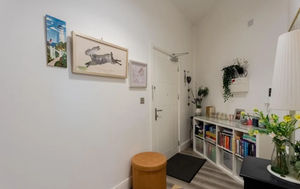 The flat features a small reception area