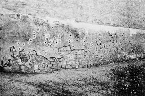 The scars of the massacre: bullet-holes, some six inches deep, in the western wall of the Jallianwala Bagh
