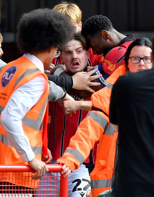 Jamie Jellis is mobbed after his goal