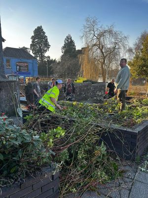 Councillors and volunteers helping to clear the Margaret Evans Memorial Garden in Builth Wells