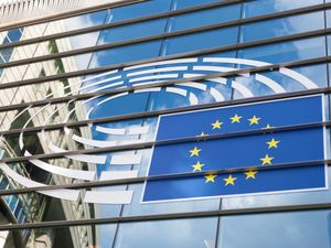 Logo of the European Parliament on the facade of the European Parliament building in Brussels