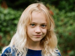 Supporting image for story: Girl, 9, raises thousands as she shaves off blonde hair to help children with cancer