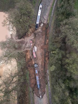 Three boats became caught up by the 50-square-metre sinkhole which developed at 4.22am today. Photo: Tom Maddick/SWNS