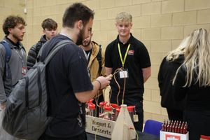 Students visiting the Muller stand.