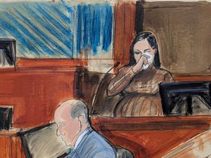 Cassie Ventura wipes tears from her eye in Manhattan federal court in New York