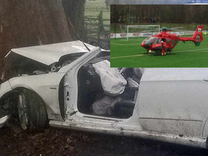Supporting image for story: Video: Teen and child cut free from car as air ambulances land at TNS football ground