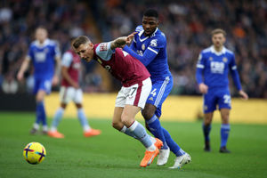 Aston Villa's Lucas Digne and Leicester City's Kelechi Iheanacho (right) battle for the ball