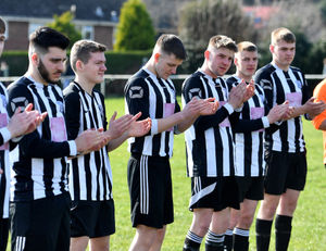 The teams applauded George before kick-off