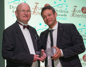 Michael Radcliffe (left) receives his Shining Star adult award from Paul Shuttleworth, representing sponsor True Potential Hypnotherapy