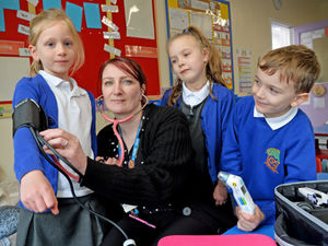Supporting image for story: School pupils meet nurse as part of real life superhero day