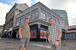 Nicc Bennett and Andy Evans outside the long-vacant former Mike Lloyd Music shop in Queen Square